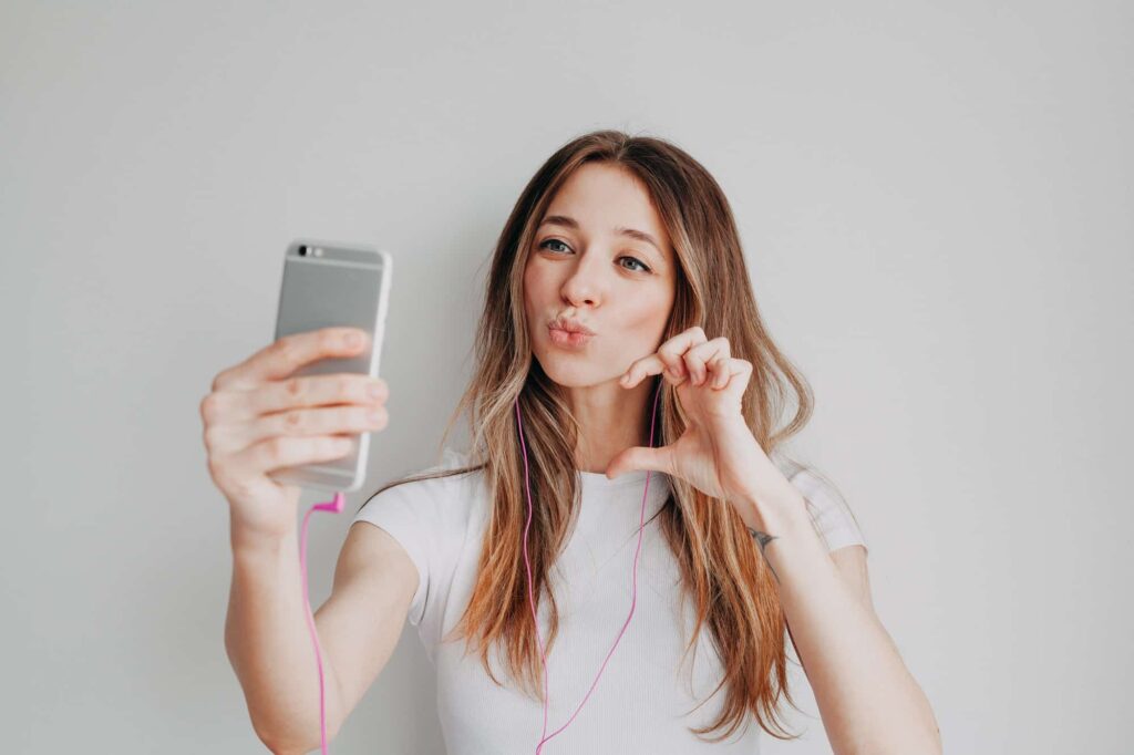 Young girl with mobile phone are making social media content, online calling, Instagram content